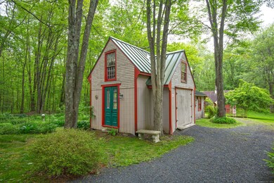 Carriage house with 100amp electric, 2 bay garage, fisher wood stove