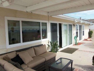 Rear from covered patio showing dual paned windows