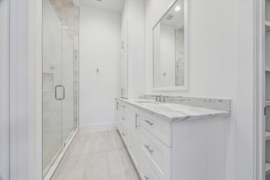 This first-floor full bath offers a spacious walk-