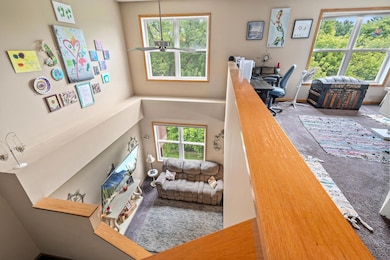 Looking into the living room from loft