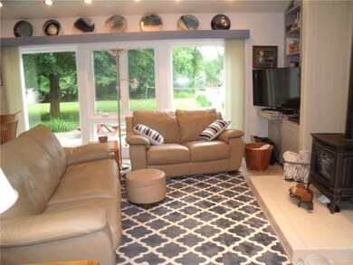 Family room with new 2018 windows and gas stove.