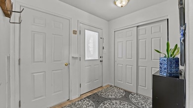 Generous foyer with large coat closet and easy access to the garage.