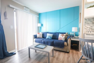 Living room with sink and light hardwood / wood-st