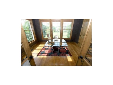 French Doors open into a handsome library or perfe