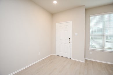 Nice natural light, pale walls and wood-look tile