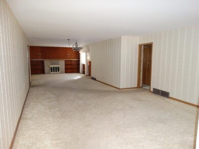 Living Room leading to Dining Room and Den