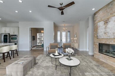 New flooring, ceiling fans, and brick surrounding
