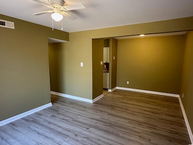 Spare room with hardwood / wood-style flooring and