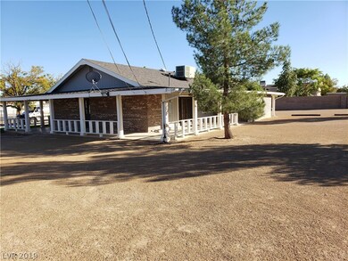 Right side and rear view of home. Entrance into Ki