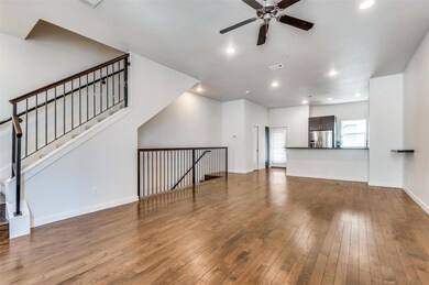 Unfurnished living room featuring hardwood / wood-