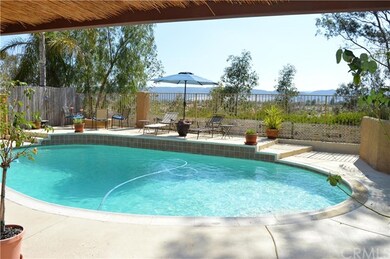 VIEW OF BACKYARD/POOL LOOKING WEST