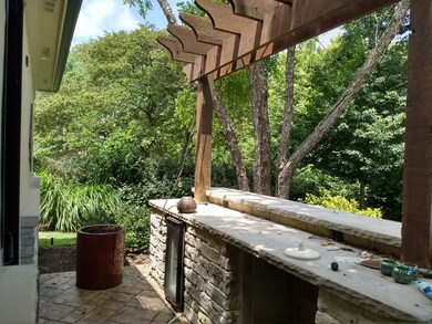 Outside entertaining by poolhouse