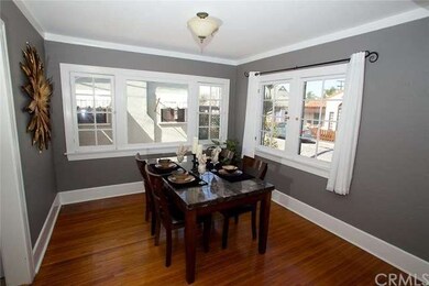 Dining room with base board and crown molding.