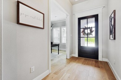 Foyer entrance with ceiling accent molding and lig