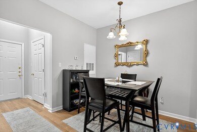 Entryway, door to laundry room, and open dining space right off the kitchen.