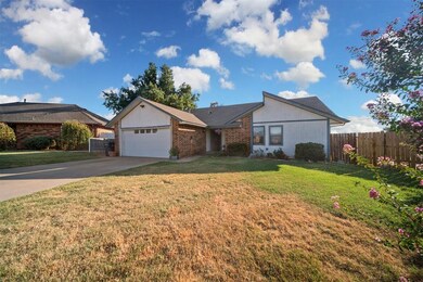 Single story home featuring a garage and a front l
