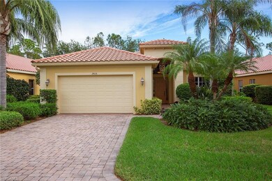 Brick paver driveway leads to the garage & front d
