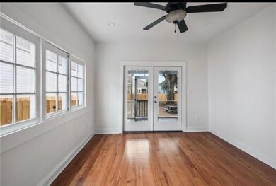Living Room with view to back porch and large yard