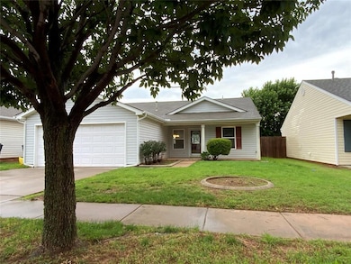 Ranch-style home with driveway, an attached garage, and a shingled roof