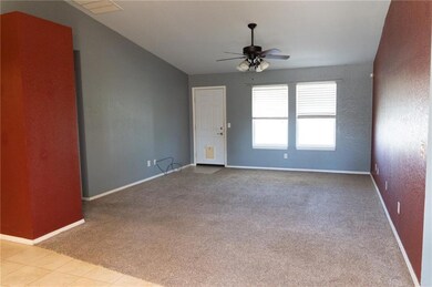 Spare room with light carpet and ceiling fan