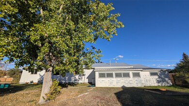View of front of property with a standing seam roof and a metal roof