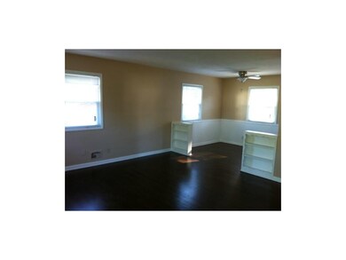 Built-in bookshelves between living room and dinin