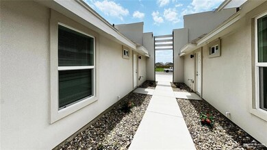 View of side of property featuring stucco siding