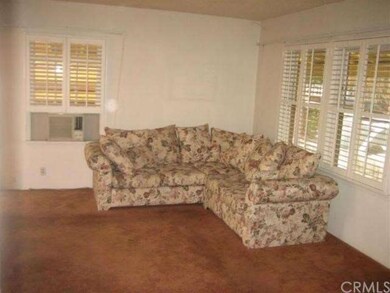 Living Room...notice Plantation Shutters
