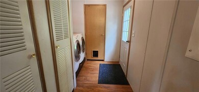 Side entry from the driveway end of house. Washer 