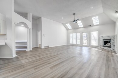 Unfurnished living room with a high end fireplace,