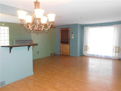 The open concept living/dining room features a lar
