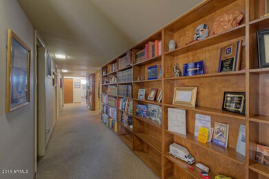 Hallway with built-in bookcases