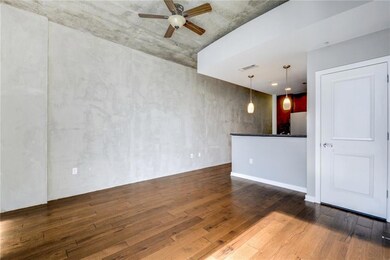 Unfurnished living room featuring hardwood / wood