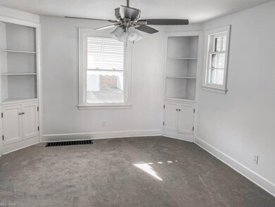The dining room has built-in cabinets.