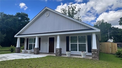 View of front of property with a porch and board a
