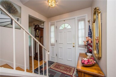 Sidelights flanking the front door allow natural l