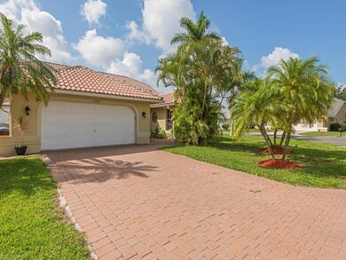 Garage with paved driveway