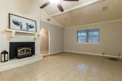 Large living room open to kitchen with high vaulte