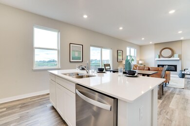 Fantastic sink in the island for easy food prep!  *Photo is of a model home, colors and finishes will differ in subject property.