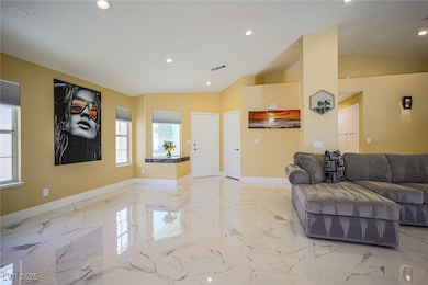 Living room featuring marble finish floor, baseboa