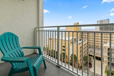 Balcony featuring a water view and a view of city