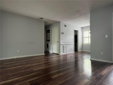Living Room looking to Hallway, Dining Room and Kitchen