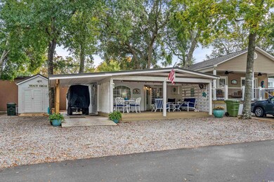 View of front of property with a storage shed