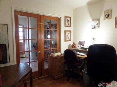 Office, with doors leading to dining room