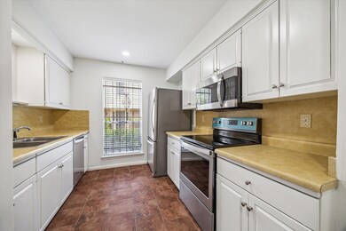 Kitchen with stainless steel appliances.