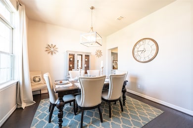 Formal dinning room with big beautiful windows to let in natural light