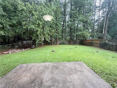 Fenced backyard featuring a patio area