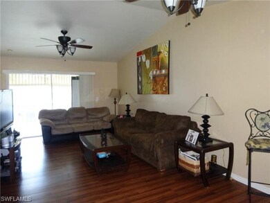 Living Room/Dining Area.  2 fans with lights are e