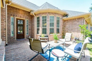 Welcoming brick paved courtyard offers timeless and traditional appeal.