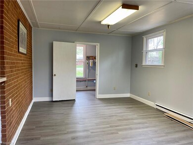 Den opens to Kitchen and Laundry Room.  Exterior door from Den to backyard